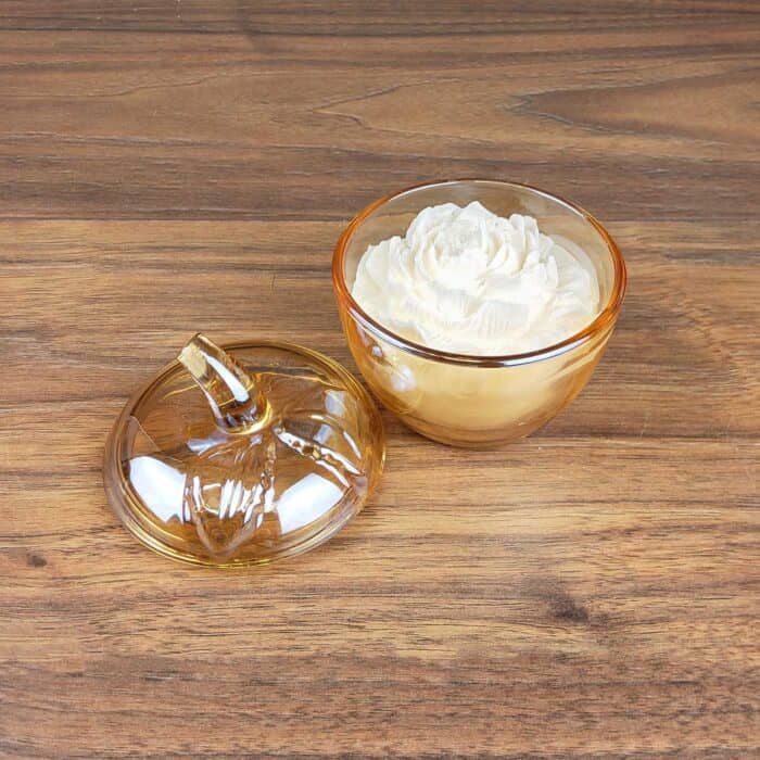 scented soy wax in a glass jar with a lid